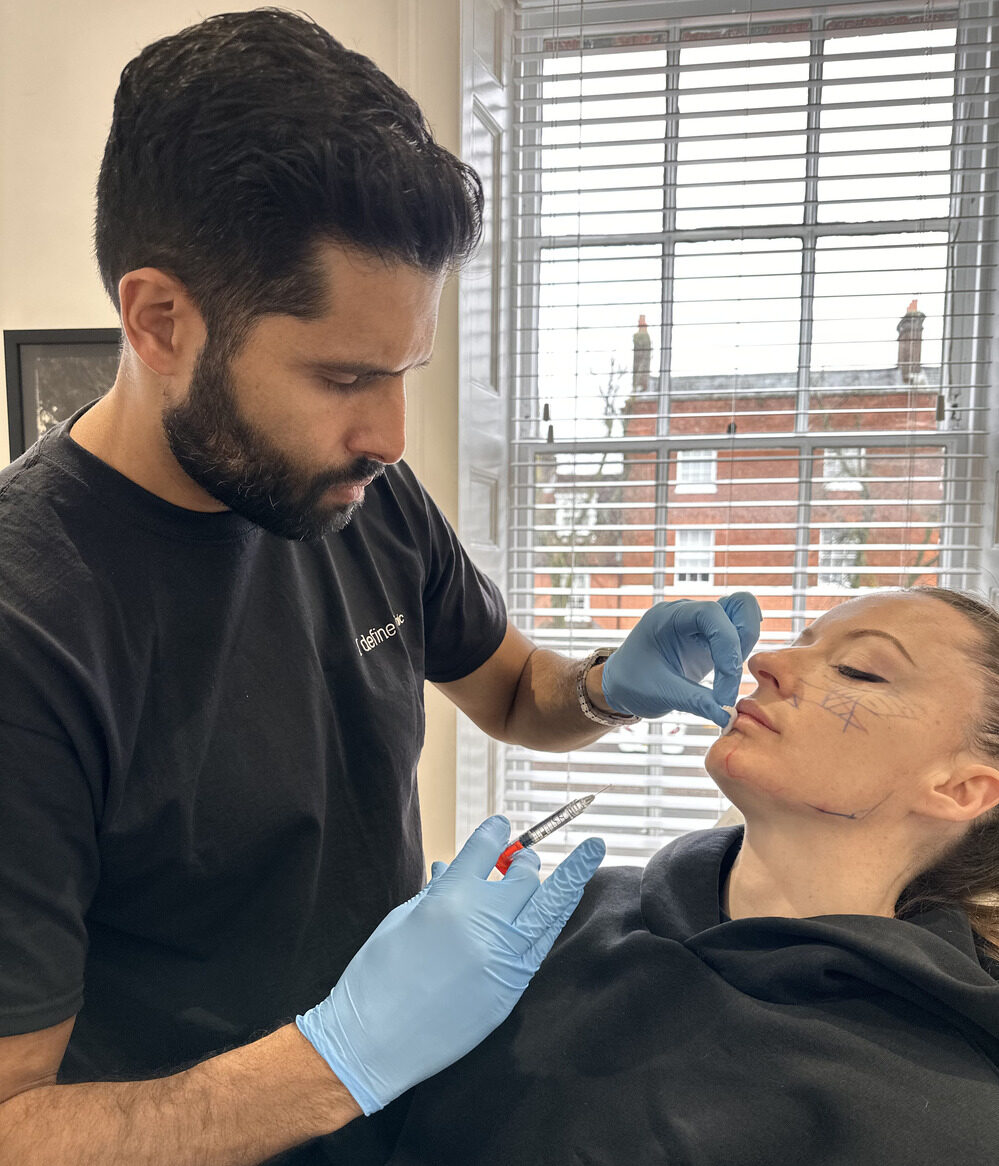 Dr Benji performing chin enhancement injections