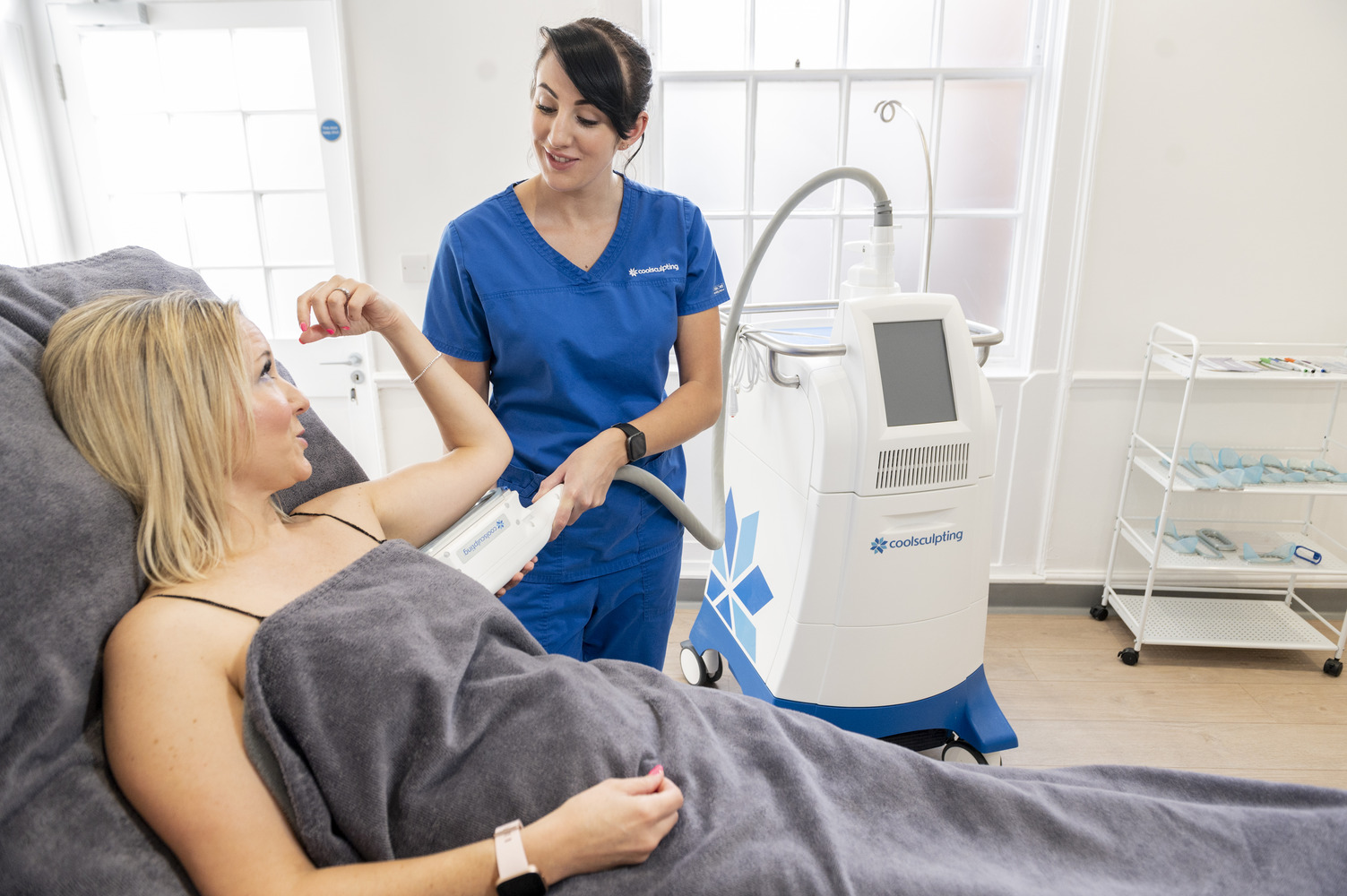 CoolSculpting under arms patient treatment with Ashleigh